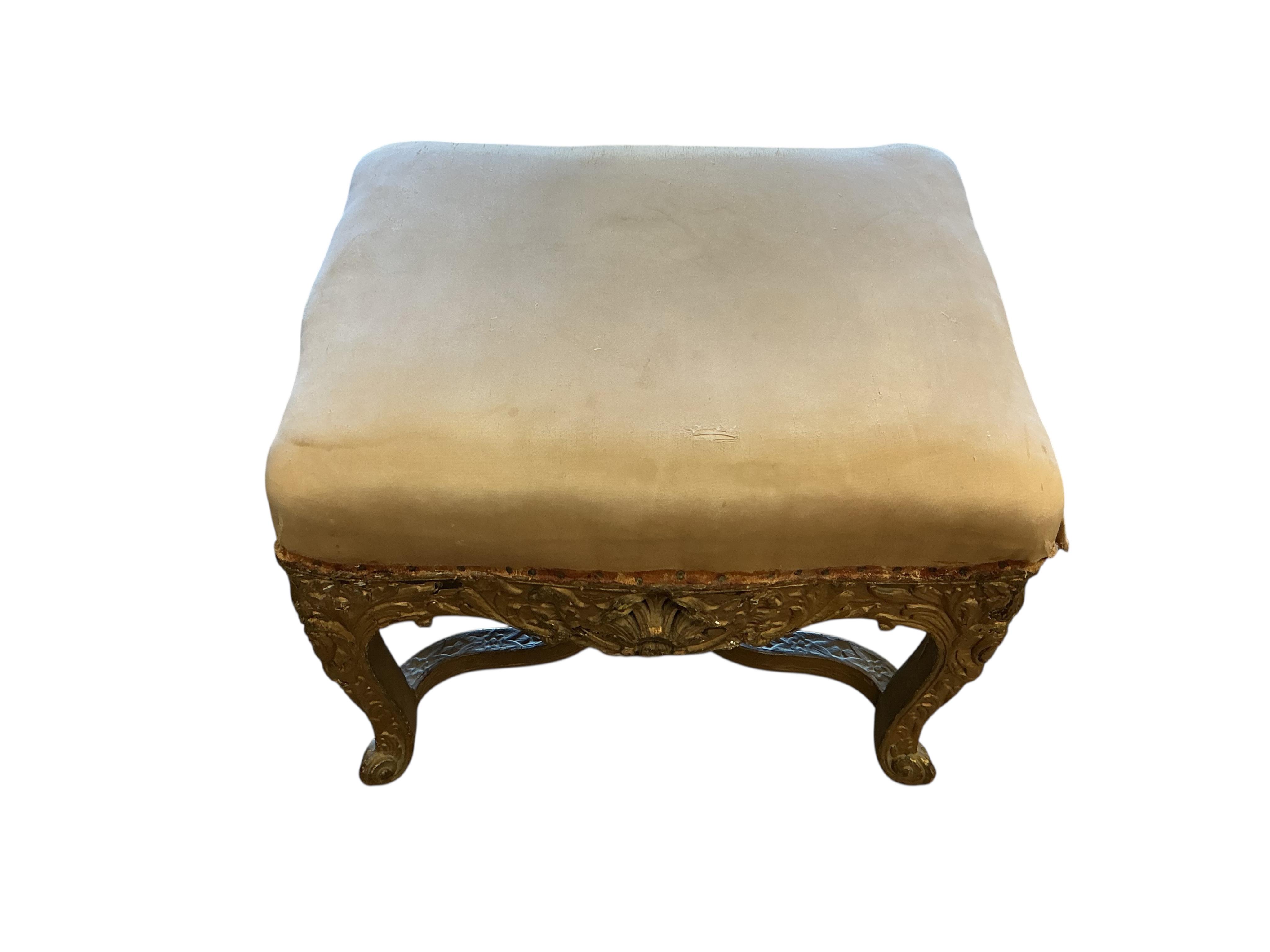An 18th century carved giltwood stool, width 50cm, depth 40cm, height 40cm